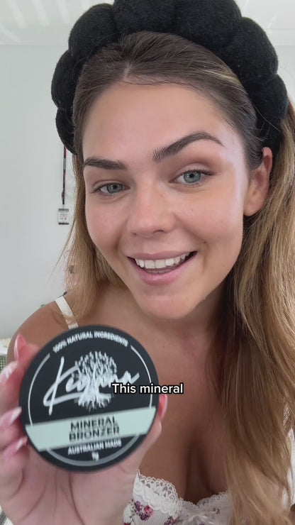 Model applying Keyana Mineral Bronzer – soft, blendable bronzer for adding warmth and a radiant, healthy complexion.